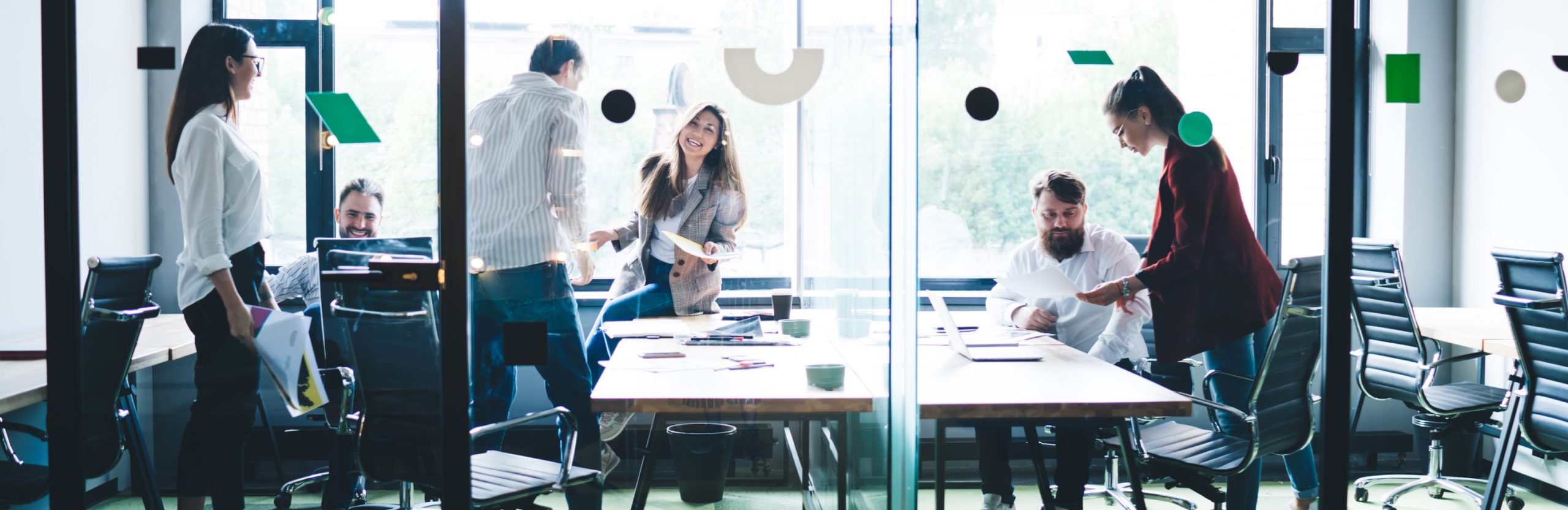 people sitting in office to represent revops and finance alignment