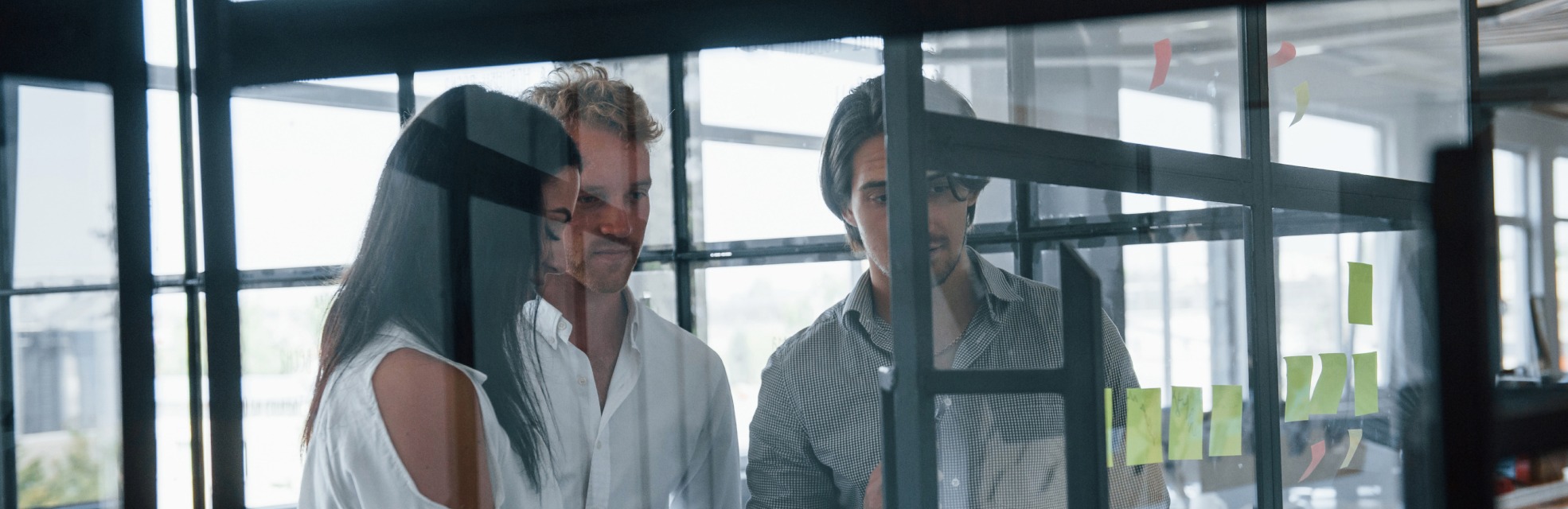 people gathered around board to represent saas customer success